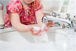 Girl washing her hands