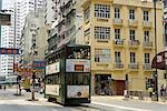 Tram running past a historical residence building,Kennedy Town,Hong Kong
