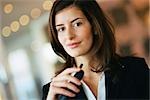 Young businesswoman smiling at camera, portrait