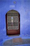 Close-up of doorway with grille built into blue wall, Rhodes, Dodecanese Islands, Greek Islands, Greece, Europe