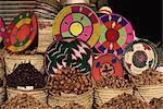 Detail of shop display selling tourist items, dates and woven basketware in bright colours, Luxor, Thebes, Egypt, North Africa, Africa