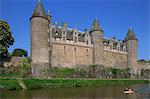 Canoe on the Odet River in front of the Josselin chateau in Brittany, France, Europe