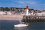 Pleasure boat and lighthouse, Trouville, Basse Normandie (Normandy), France, Europe