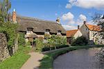 Picturesque thatched cottage at Thornton-le-Dale, North Yorkshire Moors National Park, Yorkshire, England, United Kingdom, Europe