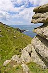 Part of the South West Coast Path at Mayon cliff near Land's End showing the Longships lighthouse in the distance, Cornwall, England, United Kingdom, Europe