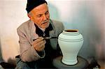 Man painting pottery vase, potters village of Safi, Atlantic coast, Morocco, North Africa, Africa