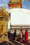 Buddhist stupa and believers spinning prayer wheels, Swayambhunath, Katmandu, Nepal