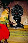 Jain priest cleaning a Jain statue, Jaisalmer, Rajasthan state, India, Asia