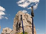 Hiking sticks and rocky mountains in background