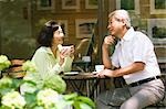Older Couple Talking over Cup of Coffee