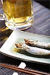 Beer and fish dish on tray