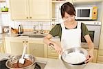 Front view of a woman whisking cream