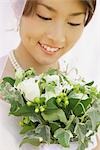 Japanese Bride Smiling,Looking at Bouquet