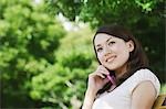 Young Woman Conversing on Mobile Phone