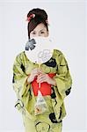 Woman in Kimono Holding Folding Fan