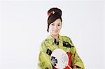 Woman in Yukata Holding Folding Fan