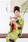 Woman in Kimono Eating Dessert