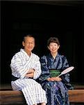 Older Couple Relaxing In Japanese Robes