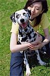 Dog and Woman In Field