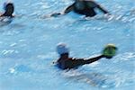 Water polo players having a game