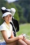 Young Asian female golfer