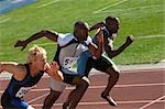 Sprinters Taking Off From Starting Blocks