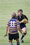 Rugby player blocking opponent player