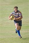 Rugby player running with ball