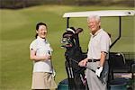 Golfers smiling and looking at camera