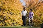 Golfers walking together in golf course