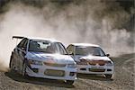 Two cars competing in rally