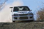 Rally car and clouds of dust