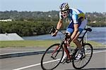 Cyclist cycling on road