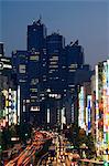 The Park Hyatt Hotel, location of the film Lost in Translation, and busy traffic at night, Shinjuku, Tokyo, Japan, Asia