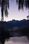 Lake Matheson at dawn, with Mount Tasman and Aoraki (Mount Cook), 3754m, Australasia's highest mountain, Southern Alps, South Island New Zealand, Pacific