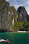 Island hopping by catamaran around coral fringe in clear waters, Bacuit Bay, El Nido Town, Palawan, Philippines, Southeast Asia, Asia