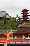 A Wedding Ceremony dance performer in front of Senjokaku 5 Story Pagoda at Itsukushima Shrine, founded in 593, UNESCO World Heritage Site, Miyajima Island, Hiroshima prefecture, Honshu Island, Japan, Asia