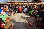 A crowd of people drumming at Changdian Street Fair during Chinese New Year, Spring Festival, Beijing, China, Asia