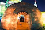 An igloo ice sculpture illuminated at night at the Ice Lantern Festival, Harbin, Heilongjiang Province, Northeast China, China, Asia