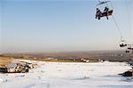 A ski lift taking skiers up to the slopes at Shijinglong ski resort, Beijing, China, Asia