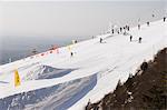 Skiers and snowboarders at Shijinglong ski resort, Beijing, China, Asia