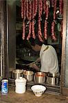 Hanging sausages in window of restaurant kitchen, Shinjuku, Tokyo, Honshu, Japan, Asia