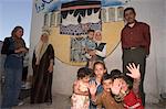 Local family with wall painting of Mecca, Apamea (Qalat at al-Mudiq), Syria, Middle East