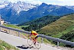 Cyclist riding over Sella Pass, 2244m, Dolomites, Alto Adige, Italy, Europe