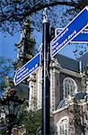 Close-up of direction sign for major sights along canal, Amsterdam, The Netherlands (Holland), Europe