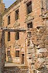 View from the courtyard of interior quarters showing ornamental decorative stonework around doors and window openings, Caerlaverock medieval castle, Dumfries and Galloway, Scotland, United Kingdom, Europe