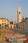 Evening light over the harbour and campanile at Lazise, Lake Garda, Veneto, Italy, Europe