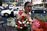 Woman selling flowers at the flower market on Adderley Street, Cape Town, South Africa, Africa