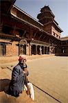 Old man in the Royal Palace courtyard, known as Mul Chowk, Durbar Square, Patan, Kathmandu valley, Nepal, Asia