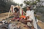 Two Sadhus smoke marijuana on the one day of the year when it is legal, during the Hindu festival of Shivaratri, Pashupatinath, Kathmandu, Nepal, Asia